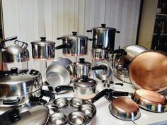 there are many pots and pans on the table