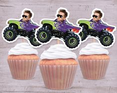 three cupcakes with monster trucks on them and one man in the background is wearing sunglasses