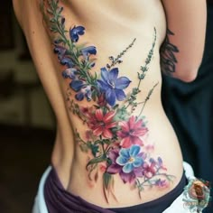 a woman's stomach with flowers on it