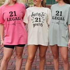 three women standing next to each other wearing t - shirts that say, 21 years ago