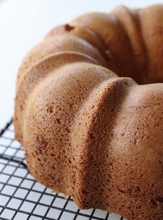 a bundt cake sitting on top of a cooling rack