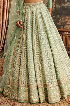 Spring green attached cancan lehenga with thread, lace embroidery in geometric pattern. Paired with pleated border embroidered padded blouse and dupatta. - Aza Fashions Elegant Unstitched Green Choli, Designer Lace Work Sets For Navratri, Navratri Sets With Lace Work, Anarkali Sets With Lace Work, Anarkali Set With Lace Work For Designer Wear, Fitted Sets With Lace Work And Traditional Drape, Lace Floor-length Sets With Dupatta, Floor-length Lace Sets With Dupatta, Green Lehenga With Intricate Embroidery In Georgette