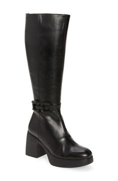 A chunky block heel and lofty platform ground this retro-chic zip boot wrapped in sleek leather and finished with a geometric bit embellishment. 3" heel; 1" platform (size 39) 15" shaft; 15" calf circumference Leather upper and lining/synthetic sole Made in Spain Leather Knee-high Boots With Chunky Platform And Wide Calf, Leather Knee-high Boots With Wide Calf And Chunky Platform, Modern Knee-high Platform Boots With Stacked Heel, Trendy High Shaft Leather Platform Boots, Modern Wide Calf Leather Platform Boots, Modern Faux Leather Platform Boots, Edgy Knee-high Platform Boots For Formal Occasions, Edgy Leather Knee-high Boots With Block Heel, Platform Boots Women