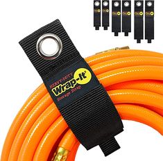 an orange extension hose with five yellow hoses and four black hose holders in the background