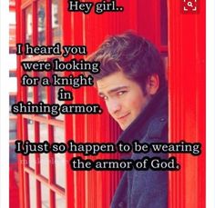 a man leaning against a red phone booth with the caption i just so happen to be wearing the armor of god