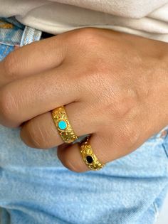 Two different handmade rings in gold color. Both of them have floral shape as designs and an oval enamel stone at the center. The first one is black and the second one is turquoise. Both of them are slightly adjustable. In Christina Christi Jewels store you can see a lot of designs in Women's Rings. You can have them in 2-4 Days with DHL EXPRESS SHIPPING DIMENSIONS - Rings Diameter is 17mm (0.67'') - US 7 - Floral Ring: 22x21 mm (0.86x0.82) - Slightly Adjustable. MATERIALS - Gold Plated 24k Pewt Gold Enamel Flower Ring For Anniversary, Gold Dome Ring With Gemstone, Gold Oval Enamel Jewelry, Oval Gold Enamel Jewelry, Adjustable Gold Turquoise Ring With Oval Shape, Adjustable Gold Oval Turquoise Ring, Elegant Adjustable Gold Turquoise Ring, Gold Enamel Open Ring Jewelry, Gold Enamel Ring For A Gift