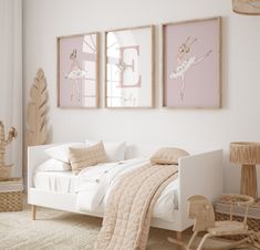 a bedroom with two framed ballet posters above the bed, and a rocking chair next to it