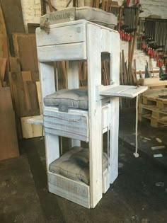 an old white wooden cabinet in a shop