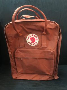 This beautifully designed and coloured Fjallraven backpack is perfect to carry smaller loads or ideal for a laptop or iPad. The beautiful bronze colour is augmented with the perfectly placed logo. The carry handles and back straps are all reinforced for added durability.  This item measures approximately 12" wide, 14" tall and 5" deep.  We promise to refund any shipping overpayments greater than $2.00.  The condition of this item is as pictured. We try and take pictures of our products that best Fjallraven Kanken Laptop, Fjallraven Backpack, Backpack Fjallraven, Fjällräven Kånken, Bronze Colour, Laptop Rucksack, Fjallraven Kanken, Backpack Purse, Bronze Color