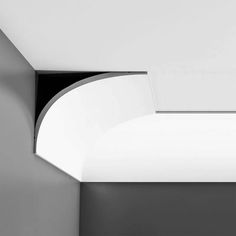 a black and white photo of a curved ceiling