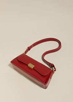 Indulge in sophistication and style with our Red Leather Baguette Shoulder Bag. The flap lock closure and adjustable strap combine practicality with elegance. The structured silhouette and flat base provide stability, while the interior slip pockets enhance organization. Handcrafted with genuine cowhide leather, this women's shoulder bag is the epitome of luxury. Size info 11" (28cm) width 4"(10cm) height 6 3/4"(17cm) depth Details Flap lock closure Adjustable shoulder strap Structured silhouett Luxury Rectangular Baguette Bag With Adjustable Strap, Luxury Baguette Bag With Adjustable Strap For Formal Occasions, Luxury Formal Baguette Bag With Adjustable Strap, Luxury Rectangular Box Bag With Hasp Closure, Everyday Luxury Flap Baguette Bag, Luxury Baguette Bag With Adjustable Strap And Flap, Luxury Baguette Bag For Everyday Use, Luxury Red Shoulder Bag With Turn-lock Closure, Elegant Clutch Baguette Bag With Adjustable Strap