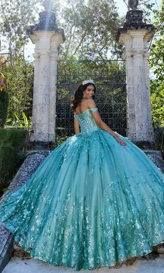 Off-the-shoulder quinceanera dress with beautiful 3D floral appliques, floral embroidery, sequins, stone accents, glitter, and a corset bodice. Puffy Quinceanera Dresses, Pastel Prom Dress, Plus Prom Dresses, Quinceanera Dresses Red, Green Quinceanera Dresses, Dresses Art, Glitter Prom Dresses, Classic Prom Dress, Purple Quinceanera Dresses