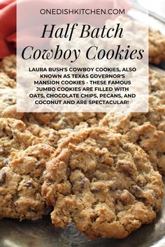 some cookies that are on top of a metal pan with the words half batch cowboy cookies