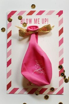 a pink bow with gold glitter on it and the words blow me up above it