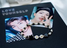 "Show your love for your favorite member with our BTS bias bracelet. Each bracelet is made of 14k gold filled beads and your choice color of seed beads and two star beads. Pictured photo is in the color OBSIDIAN.  **FOR COLOR OPTIONS PLEASE SEE 3rd PHOTO** Note: Each purchase will come with 2 photo cards. They will vary from photo and be randomly selected. Please choose your color in \"PERSONALIZATION\" section. Please message me for any questions :)" Star Beads, Picture Photo, Photo Cards, Seed Beads, Color Options, Gold Filled, Jewelry Bracelets, Statement Necklace, Crown Jewelry