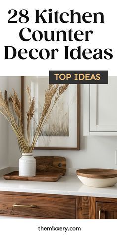 the kitchen counter is decorated with white and brown decor, including an oval bowl on top