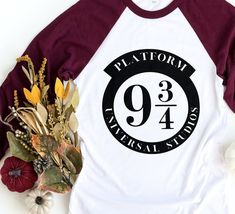 a t - shirt with the number 944 on it next to flowers and leaves