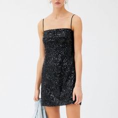 Shimmer And Shine In This Allover Sequin Dress From Uo. Features Fitted Silhouette With A Straight Neckline And Topped With Adjustable Shoulder Straps. Finished With A Mini Length Hem.; 66% Polyester, 34% Metallic Fibres; Machine Wash; Urban Outfitters Sleeveless Party Dress, Urban Outfitters Sleeveless Mini Dress For Party, Urban Outfitters Sleeveless Mini Dress For Evening, Black Shimmer Mini Length Dress, Sleeveless Sequin Mini Dress For Dinner, Black Shimmer Mini Dress For Cocktail, Elegant Night Out Dresses By Urban Outfitters, Elegant Urban Outfitters Mini Dress For Date Night, Urban Outfitters Elegant Mini Dress For Date Night