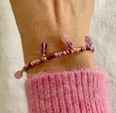 This violet and pink seed beads and charms beads bracelet ? Yes ! A bracelet you'll Love :-) Wear it alone or in a trendy stacking style... Close your eyes and put this bracelet on... See how beautiful it is on you ! * Materials: High quality GOLD FILLED 14 carat gold clasp and extension chain. Gold-filled is a thick layer of gold on metal, a higher-quality material than gold-plated. Charms : High quality glass beads diam 6mm set in GOLD FILLED 14 carats. Best quality glass seed beads. * Size: The bracelet measures 19cm + an extension chain of 3 cm. * Customization If you want a different length or a particular color, write me a message. I will be happy to make your unique design ! * Delivery The parcel is shipped within 1 to 2 days by 📩 TRACKED PARCEL SERVICE 📩 Your jewelry comes in a p Trendy Pink Beaded Charm Bracelet, Pink Round Beads Charm Bracelet For Friendship, Pink Charm Bracelet With Round Beads For Friendship, Pink Charm Bracelet With Colorful Round Beads, Pink Charm Bracelet With Colorful Beads, Handmade Pink Charm Bracelet For Friendship, Bohemian Purple Bracelets With Heart Beads, Dainty Purple Beaded Bracelets With Round Beads, Lavender Bracelets With Tiny Beads For Gift