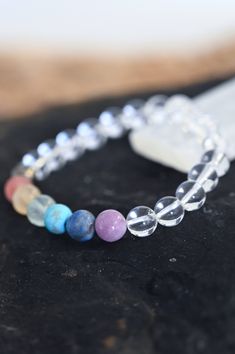 Thrive in your Quartz chakra bracelet! Wear this gorgeous bracelet every day and never forget the importance of taking care of you and your needs. Fill your cup so much it runs over and pours out into everything else you do. Quartz is the power stone that encourages crystal clarity on your path. This paired with the 7 Chakra crystals bring balanced energy across your chakras that allows you to truly thrive! AAA chakra gemstone & clear quartz beads 8mm Amethyst, Lapis Lazuli, Turquoise, Fluorite, Handmade Cheap Crystal Bracelet For Beach, Rainbow Gemstone Beads Bracelets For Healing, Rainbow Gemstone Beads Bracelet For Healing, Rainbow Gemstone Beads Healing Bracelet, Rainbow Crystal Bracelet With Natural Stones For Healing, Healing Rainbow Natural Stone Bracelets, Rainbow Bracelet Jewelry For Healing, Healing Mineral Crystal Bracelet, Healing Crystal Bracelet With Gemstone Beads