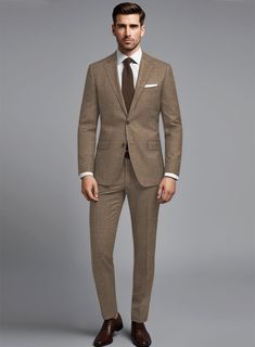 Ignite your fearless spirit with the opulent Noble Brown Wool Silk Linen Suit, a powerful statement of unrivaled style. With its exquisite blend of wool, silk, and linen, it exudes sophistication. Feel the smooth, lightweight fabric drape gracefully around you, enhancing your every move. From formal events to casual occasions, this luxurious suit elevates your wardrobe. Own this pinnacle of sartorial excellence now.    About Noble Collection:  A seamless union of refined craftsmanship and Italian luxury. Impeccably tailored from superior wool, silk, linen, these contemporary designs embody sophisticated elegance. Experience the breathability of wool, brilliance of silk, freshness of linen – distinctive hallmarks defining the Noble Collection. Immerse yourself in this timeless ensemble, whe Tailored Silk Suits For Fall, Luxury Fitted Tweed Jacket With Suit Collar, Timeless Silk Suits For Business Casual, Luxury Single Breasted Workwear Set, Timeless Formal Fall Suits, Elegant Business Sets For Fall, Elegant Wool Suits With Concealed Placket, Elegant Brown Suits With Concealed Placket, Elegant Brown Suits For Business Casual