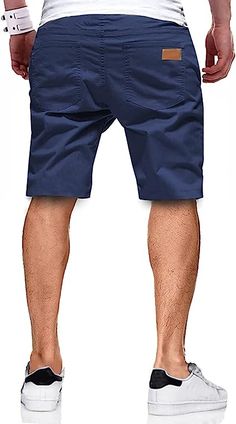 Stay comfortable and stylish on the golf course with our Casual Golf Cargo Shorts. Made from a high-quality blend of cotton and elastane, these shorts offer a lightweight and breathable feel. The drawstring closure provides a secure fit, while the fastening pockets ensure your belongings stay safe. Perfect for a casual round of golf or everyday wear, these shorts are a must-have for any golfer's wardrobe. Features: 98% Cotton, 2% Elastane Drawstring closure Hand Wash Only Quality Fabric: 98% Cot Summer Cotton Cargo Shorts For Sports, Cotton Athletic Shorts For Outdoor Activities, Cotton Golf Bottoms With Built-in Shorts, Cotton Bottoms With Built-in Shorts For Golf, Sporty Cotton Golf Shorts, Cotton Golf Shorts For Summer, Summer Cotton Golf Shorts, Casual Cotton Golf Shorts, Casual Cotton Shorts For Golf