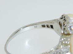 "This exquisite little treasure features 3 luscious white pearls surrounded by 14 small old European and old mine cut diamonds . Set in 18K white gold. The ring is a size 6.75. Setting measures approx. 1/2\" tall. This ring is in excellent pre-owned vintage condition. Total weight is approx. 4.8 grams. (T8 * MJP038283) Please review all photos before purchasing and feel free to ask questions about the item :) For more information you can call us at 360-657-5276. We are sorry but we do NOT offer Pearl Diamond Ring, Natural Man, Tanzanite Diamond Ring, Pearl And Diamond Ring, Diamond Wedding Sets, Engagement Sets, Lapis Lazuli Ring, Pearl Diamond, Emerald Diamond