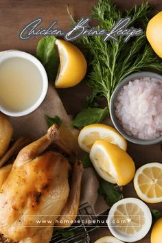 chicken, lemons and other ingredients on a table