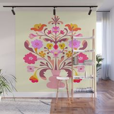 a wall mural with flowers and birds in pink, orange, yellow and red colors