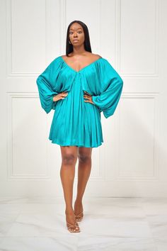 As Kenya Moore would say, 'Gone with the Wind Fabulous'. You'll definitely be muttering that as you sashay down the street in this gorgeous blue dress with long sleeves, a classic V neck at the front and back, full lining and back tie detail. No one will accuse you of not being a fashion maven with this on! Pair with gold accessories for an elegant look! CONTENT & CARE Hand wash with cold water Do not bleach Iron on low heat Self and Lining: Polyester DEETS & FIT Model is wearing a size Long Sleeve Off Shoulder Dress For Brunch, Blue Long Sleeve V-neck Dress For Spring, Flowy Long Sleeve Mini Dress For Evening, Fall Cocktail Off-shoulder Long Sleeve Dress, Fall Cocktail Off Shoulder Long Sleeve Dress, Blue Mini Length Long Sleeve Dress For Spring, Blue Mini Long Sleeve Dress For Spring, Chic Blue Long Sleeve Dress For Spring, Blue V-neck Long Sleeve Dress