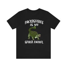 I see you are checking out this dinosaur t-shirt. If you're looking for a gift for a dinosaur lover or a treat for yourself then you've come to the right place. Are you asking yourself what should I get my dinosaur lover for his birthday or special occasion? These awesome t-shirts are explicitly designed for people who love dinosaurs and paleontology. These awesome designs are a perfect way for dinosaur lovers to show their passion and love for these creatures and start conversations. Make your dino lover happy and ORDER NOW this excellent dinosaur gift! Soft cotton and quality print make users fall in love with it over and over again. These t-shirts have-ribbed knit collars to bolster shaping. The shoulders have taping for better fit over time. Dual side seams hold the garment's shape for Dinosaur Tshirt, My Spirit Animal, Dinosaur Gifts, Dinosaur Shirt, My Spirit, A Dinosaur, Heart Gifts, Toddler Kids, Animal Shirts