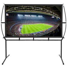 a large screen tv on a stand in front of a stadium