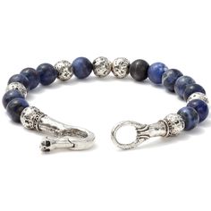 This piece is a unique blend of two exceptional materials. One is Sterling Silver that the master craftsman John Varvatos often uses to elevate the design of metal features and add a layer of luxury to the piece. The other is Sodalite. He uses this rare gemstone only when the item demands natural aquatic tones no other stone can match. Sodalite can be found only in a few places around the world. Only a small percentage of those qualify as jewel-worthy. And an even smaller percentage of those are Elegant Lapis Lazuli Gemstone Bracelets, Luxury Gemstone Beads For Jewelry Making, Elegant Handmade Sapphire Bracelets, Elegant Handmade Lapis Lazuli Bracelets, Luxury Handmade Lapis Lazuli Jewelry, Luxury Blue Round Bead Bracelets, Luxury Silver Beaded Bracelets With Gemstone, Luxury Blue Beaded Bracelets, Elegant Round Sodalite Jewelry