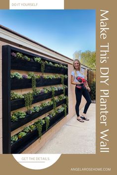 a woman standing next to a wall with plants growing on it and the words, make this diy planter wall