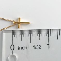 This tiny gold cross necklace is a classic addition to your layering necklaces. This minimalist necklace is also perfect by itself. - The cross charm is gold plated over sterling silver and measures approximately 12 mm in length or 1/2 inch. The dainty chain is 14k gold fill. This cross necklace is available in lengths from 14 - 20 inches. The model is wearing a 16 inch length. - Your new tiny cross necklace will come in a box, ready for gift giving. More Christian jewelry https://www.etsy.com/s Dainty Cross Necklace With Delicate Chain For Everyday, Dainty Everyday Cross Necklace With Delicate Chain, Adjustable Gold Cross Pendant Necklace, Simple Everyday Cross Pendant Necklace, Dainty Cross Necklace For Everyday, Dainty Yellow Gold Cross Necklace For Everyday, Simple Everyday Cross Necklace, Minimalist Gold Cross Necklace, Minimalist Cross Charm Necklace With Delicate Chain