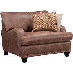 a brown leather couch with two pillows on the armrests and a decorative throw pillow