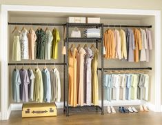 an organized closet with clothes and shoes