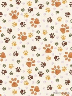 an animal paw print on white paper with brown, orange and green paws in the background