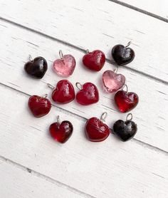 Glass Heart Shaped Charm Drops in Assorted Red/Pink Colors Size 10mm or 14mm An assortment of heart shaped charm drops made of glass, in different shades of red and pink. The charms have a flexible silver loop that you can close to attach these items to jewelry or other crafts that you are making. The charms come in size 10mm OR 14mm (your choice). Package Size Options Include: -5 Charms -10 Charms PLEASE NOTE: The images are enlarged to show the details of the charms so that you can get a bette Different Shades Of Red, Glass Heart, Brown Bags, Shades Of Red, Heart Charm, Color Splash, Pink Color, Gift Tags, Heart Shapes