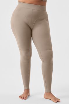 A subtle nod to the ’80s, these leggings have coolly contrasting ribbed panels and bikini bottom seaming. We love the high-rise, full-length fit and the stretchy elastic waistband with a tonal Alo logo. And they’re done in Alosoft—our coziest fabric with a buttery feel and a brushed finish. Complete the look with the matching Alosoft Head Start Bra. Beige Compression Athleisure Bottoms, Beige High Stretch Athleisure Bottoms, Beige High Stretch Bottoms For Athleisure, Sporty Fitted Beige Bottoms, Beige Fitted Sporty Bottoms, Alo Yoga Bottoms With Ribbed Waistband, Alo Yoga High Stretch High Waist Bottoms, Versatile Micro-elastic Bottoms By Alo Yoga, Alo Yoga Stretch Elastane Bottoms