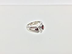 "Hi everyone, just wanted to let you know we are open and shipping daily. Silver Garnet Ring // Matte Platinum (Rhodium) Finish // Handmade // Modern Design // Size 7 Beautifully crafted \"one of a kind\" contemporary Sterling Silver ring with genuine Garnet center stone. This garnet is of a deep ruby red color. The silver ring is finished with Rhodium so it will not tarnish. This fine jewelry quality ring is perfect for work and formal occasions to match your sterling, white gold or platinum je Silver Garnet Solitaire Ring, Modernist White Gold Ring For Gift, Modernist White Gold Ring As Gift, Modernist White Gold Rings For Gifts, Modern White Gold Ruby Ring For Anniversary, Modernist White Gold Ring Gift, Modern Garnet Rings For Formal Occasions, Modern Garnet Rings For Formal Events, Modern Sterling Silver Sapphire Ring Gift