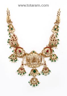 22 karat gold 'ram parivar - peacock' necklace with cz,color stones , pearls & beads (temple jewellery)

enhance your beauty with 22 karat gold 'ram parivar - peacock' necklace  add a touch of elegance to your look with this exquisite 22 karat gold 'ram parivar - peacock' necklace from totaram jewelers. handcrafted in india, this stunning piece features a beautiful design that combines cz, ruby, emerald, pearls, and beads, giving it a unique and sophisticated appeal. the intricate detailing and 22k Gold Necklace, Temple Jewelry Necklace, Gold Temple Jewellery, Peacock Necklace, Modern Gold Jewelry, Enhance Your Beauty, Color Stones, Ruby Emerald, Gold Jewelry Indian