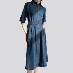 Be the envy of the town with our 2023 Summer Collection's Loose Medium-Wash Jean Dress! This 90s-flair denim piece marries timeless elegance and fashion fashion. combining a elongated silhouette. short sleeves. buttons & belt closure. and a medium-wash for an irresistible look.Why You'll Fall In LoveThis dress is a piece of art in itself! Its baggy shape and medium-wash fabric offer an effortless and informal fit. while its sophisticated brief sleeves and buttons & belt closure add a unique touc Belted Denim Dress For Summer Workwear, Elegant Fitted Denim Dress, Belted Midi Denim Dress In Medium Wash, Belted Medium Wash Dress For Work, Classic Denim Dress For Workwear In Spring, Classic Spring Denim Dress For Work, Blue Washed Dresses For Fall, Dark Wash Midi Dress With Pockets, Chic Medium Wash Belted Denim Dress