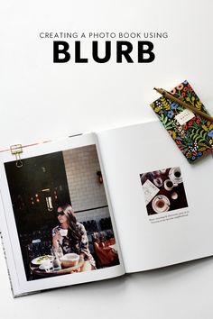 an open book with photos on it and the title'creating a photo book using blurb '