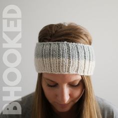 a woman wearing a knitted headband and looking down