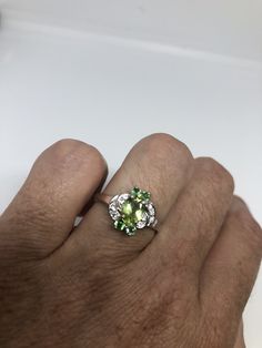 Rich and very bright Peridot, green chrome diopside white white sapphire ring Sterling silver with rhodium finish Size 6.75 can be sized by my jeweler. His service charge is $10-$20 All rings are shipped in a nice gift box. Check out our over a THOUSAND great reviews Engraving is $4 per letter and is not always perfect depending on the piece. It can take a few days if the jeweler is busy. This is payable to Paypal Judithsltd@gmail.com Gothic Ring, Green Chrome, White Sapphire Ring, Peridot Green, Gothic Rings, Green Peridot, Multi Stone Ring, White Sapphire, White White