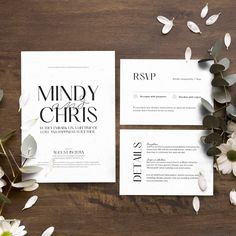 wedding stationery with white flowers and greenery