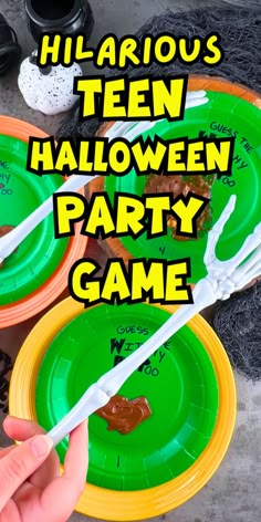 there is a person that is holding some paper plates with food on them and the words halloween party game above it