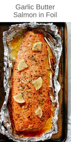 garlic butter salmon in foil on a baking sheet