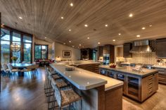 a large kitchen with an island and lots of counter space in the middle of it